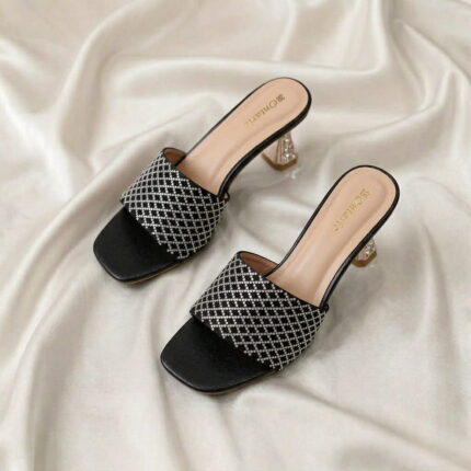 Midnight Crystal Heel – Black crystal-studded mule heels with a sculpted metallic heel.