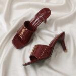 Ruby Mule Heel – Maroon glossy mule heel with gold-tone detailing and square-toe design.