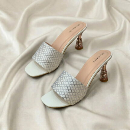 Midnight Crystal Heel – White crystal-studded mule heels with a sculpted metallic heel.