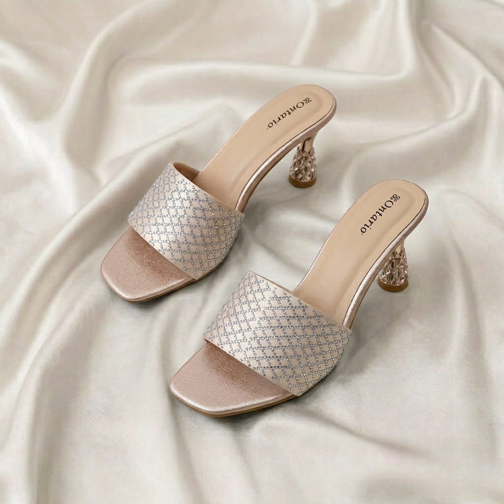 Midnight Crystal Heel – Baby Pink Midnight Crystal Heel – Baby Pink crystal-studded mule heels with a sculpted metallic heel.