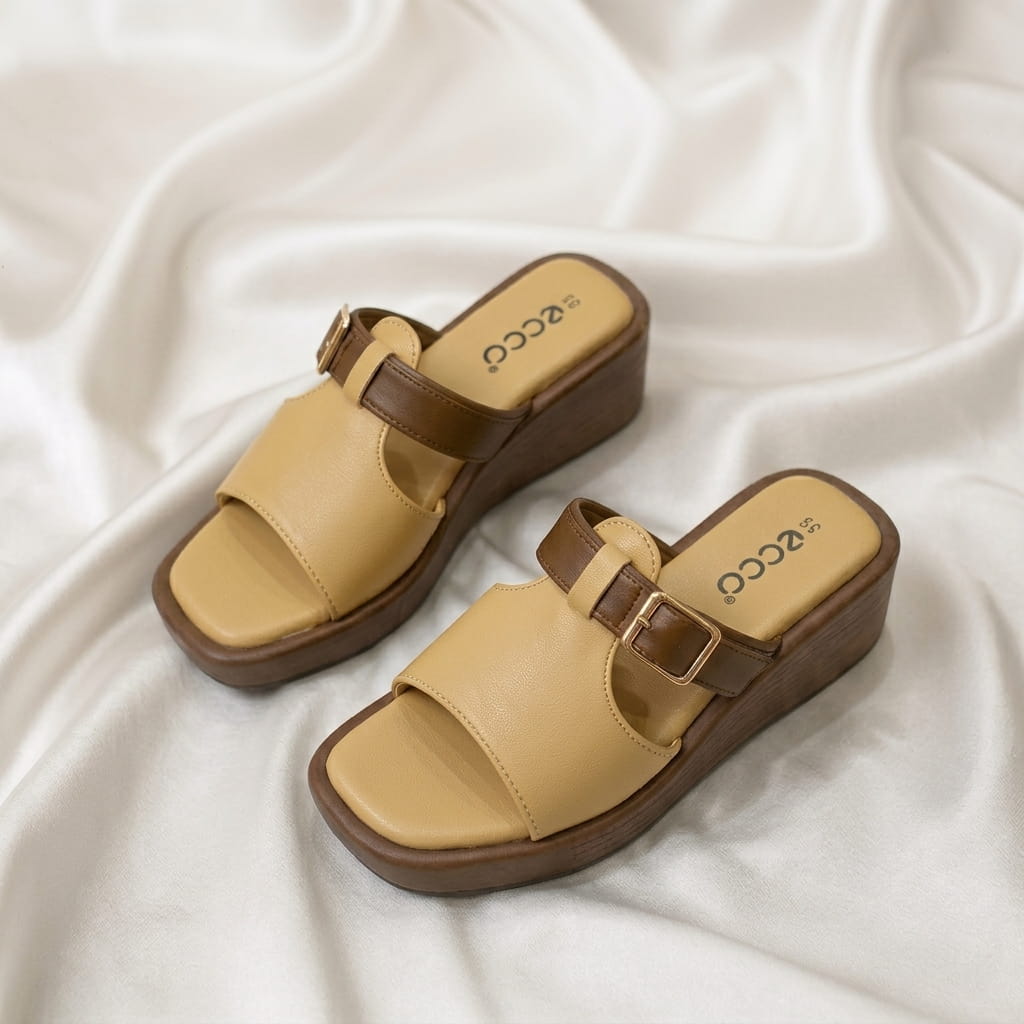 Wedge Buckle Sandal – Master Chocolate Wedge Buckle Sandal – Master Chocolate with buckle detail and comfortable wedge sole.