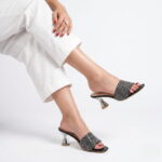 Midnight Crystal Heel – Black crystal-studded mule heel with a sculpted metallic heel.