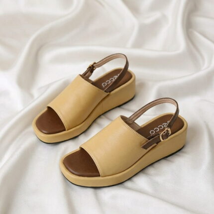 Aura Wedge Sandal – Master with open-toe design, slingback strap, and wedge sole.