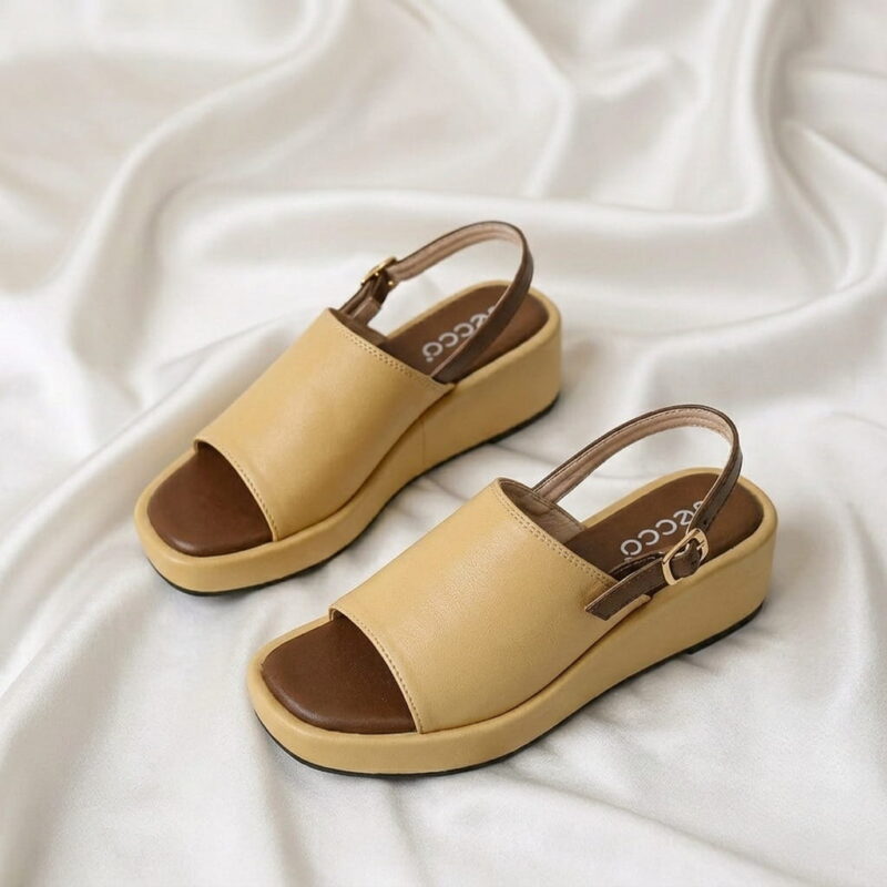 Aura Wedge Sandal – Master with open-toe design, slingback strap, and wedge sole.