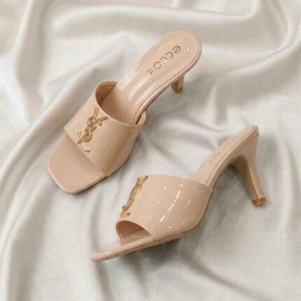 Ruby Mule Heel – Beige glossy mule heel with gold-tone detailing and square-toe design.
