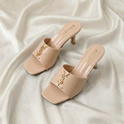 Ruby Mule Heel – Beige glossy mule heel with gold-tone detailing and square-toe design.