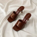 Ruby Mule Heel – Chocolate glossy mule heel with gold-tone detailing and square-toe design.